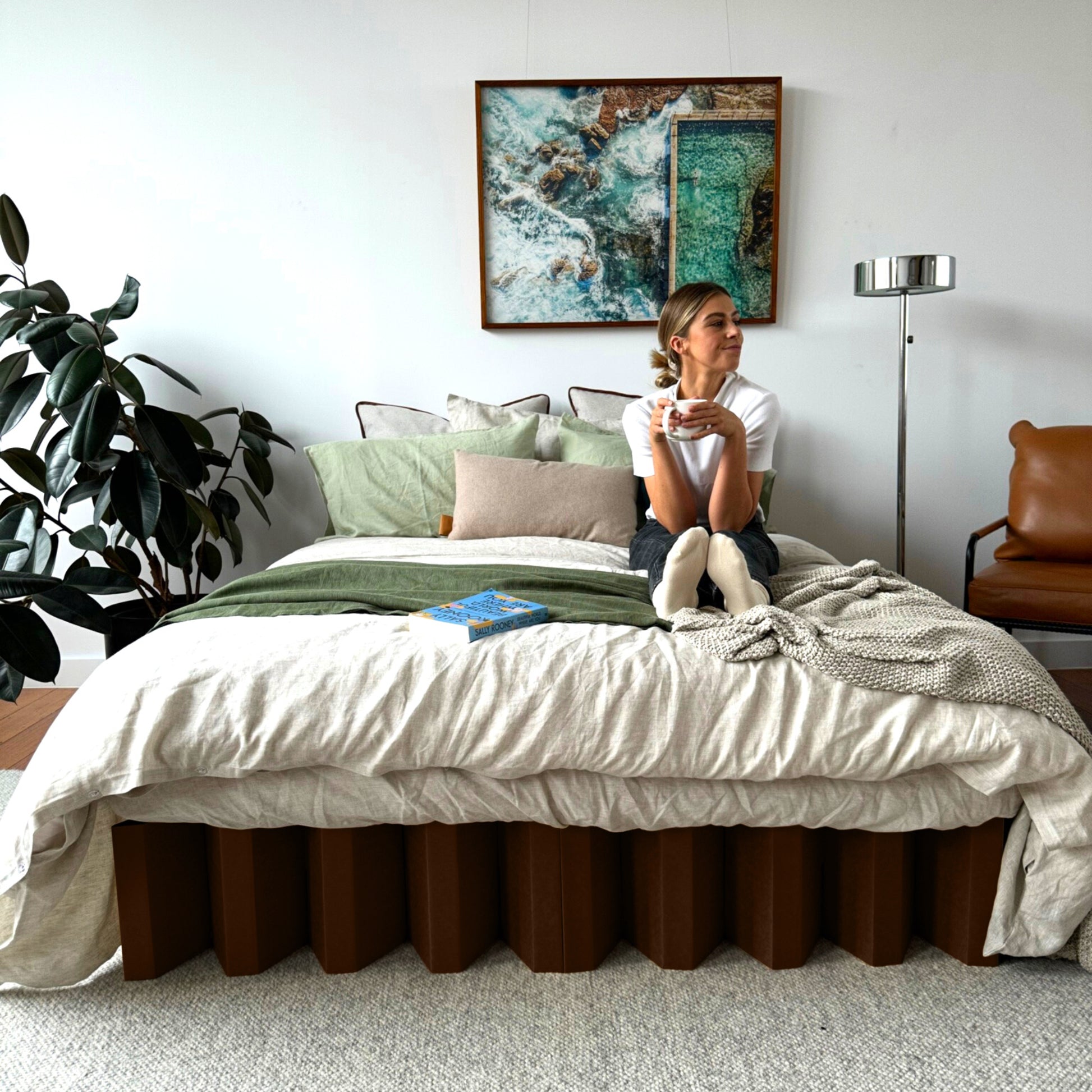 Yona Cardboard Bed in a dark oak finish styled in a lifestyle bedroom setup